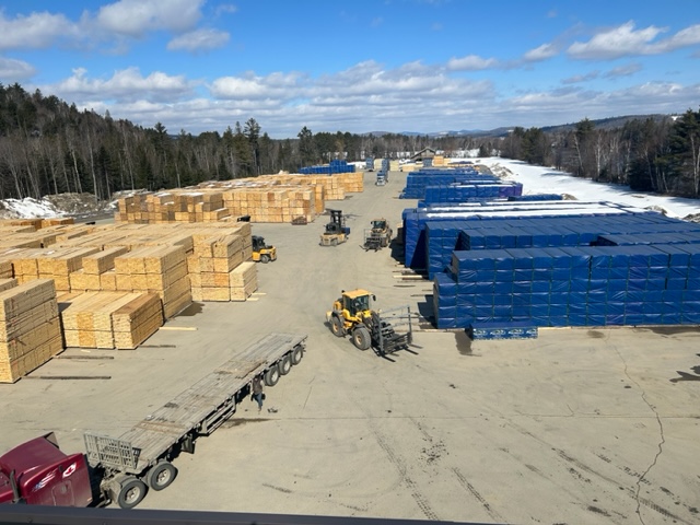 Stacks of lumber in an outdoor storage yard