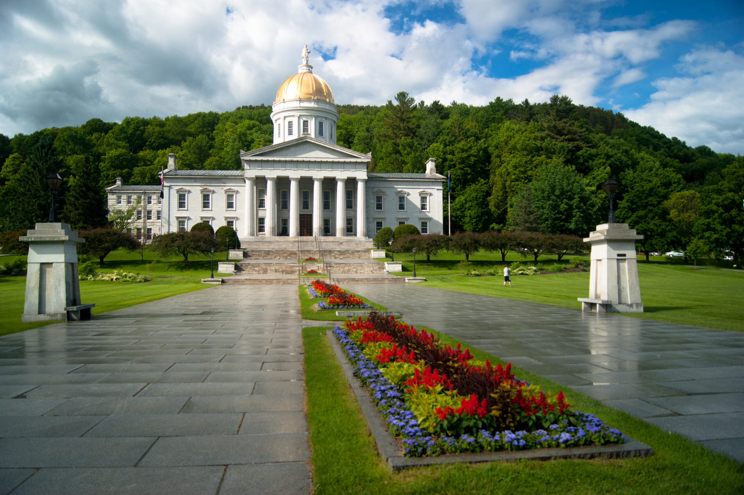 Vermont State House and flowerbeds after rainfall