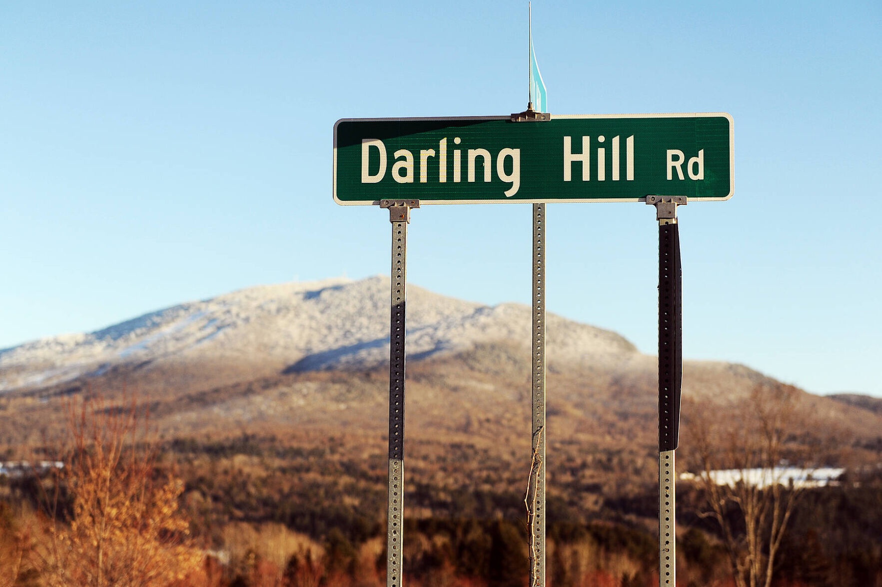 Darling Hill Road street sign with autumn hills in the background