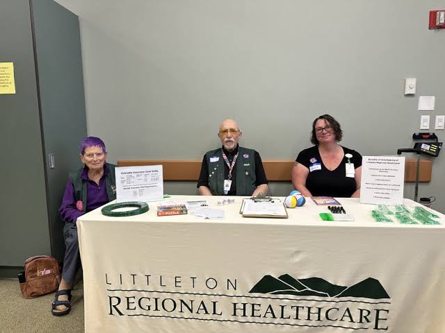 Volunteers at a Littleton Regional Healthcare information table