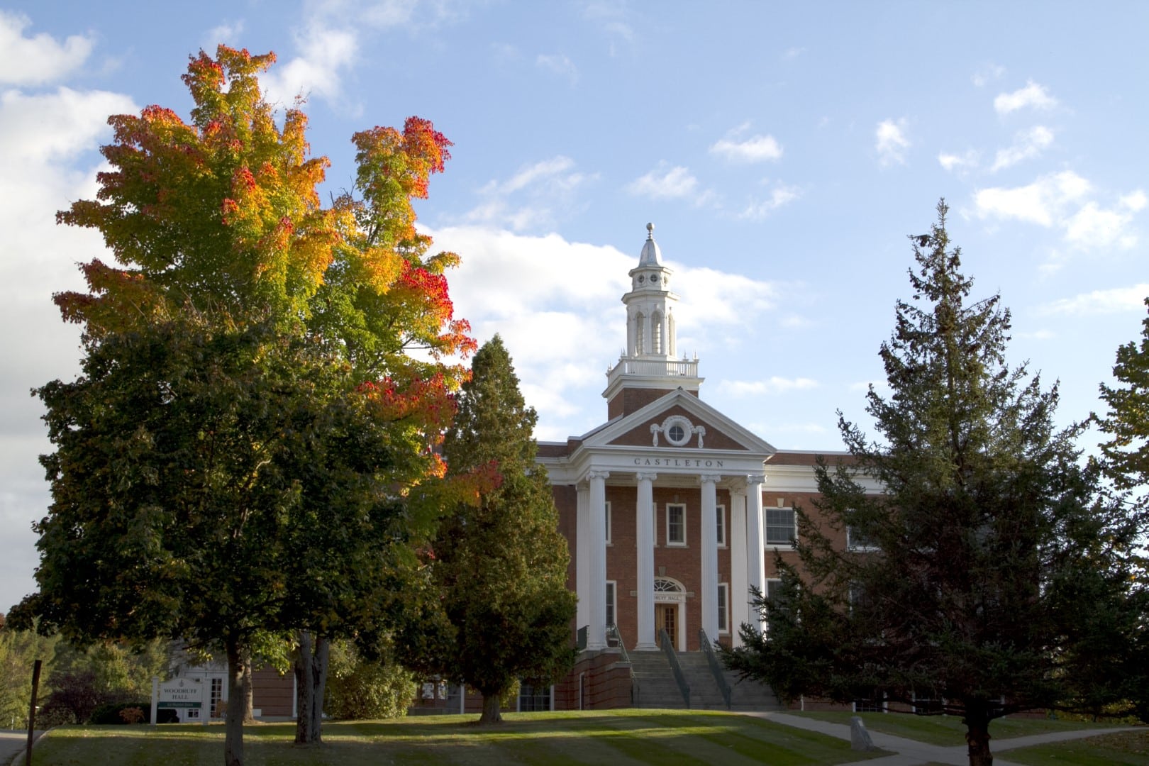 St. Johnsbury Academy building behind autumn trees
