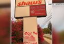 Graffiti spray-painted on a business sign along Main Street in Lancaster
