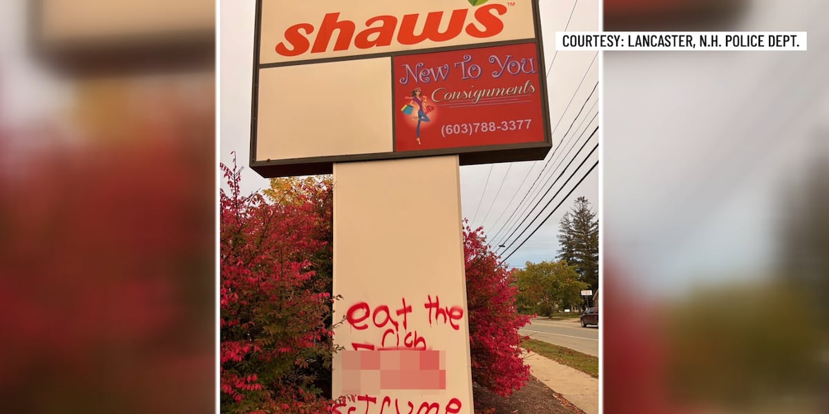 Graffiti spray-painted on a business sign along Main Street in Lancaster