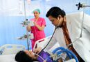 Healthcare worker examining a patient in a hospital