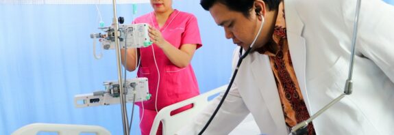 Healthcare worker examining a patient in a hospital