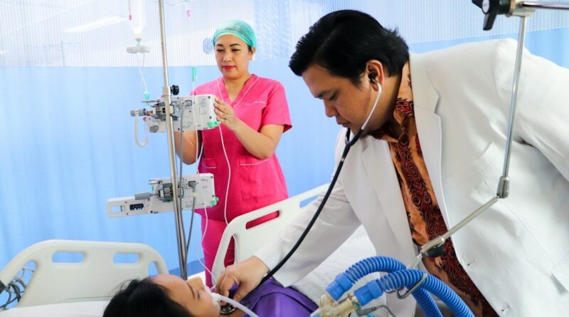 Healthcare worker examining a patient in a hospital
