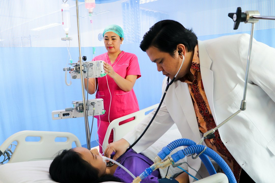 Healthcare worker examining a patient in a hospital